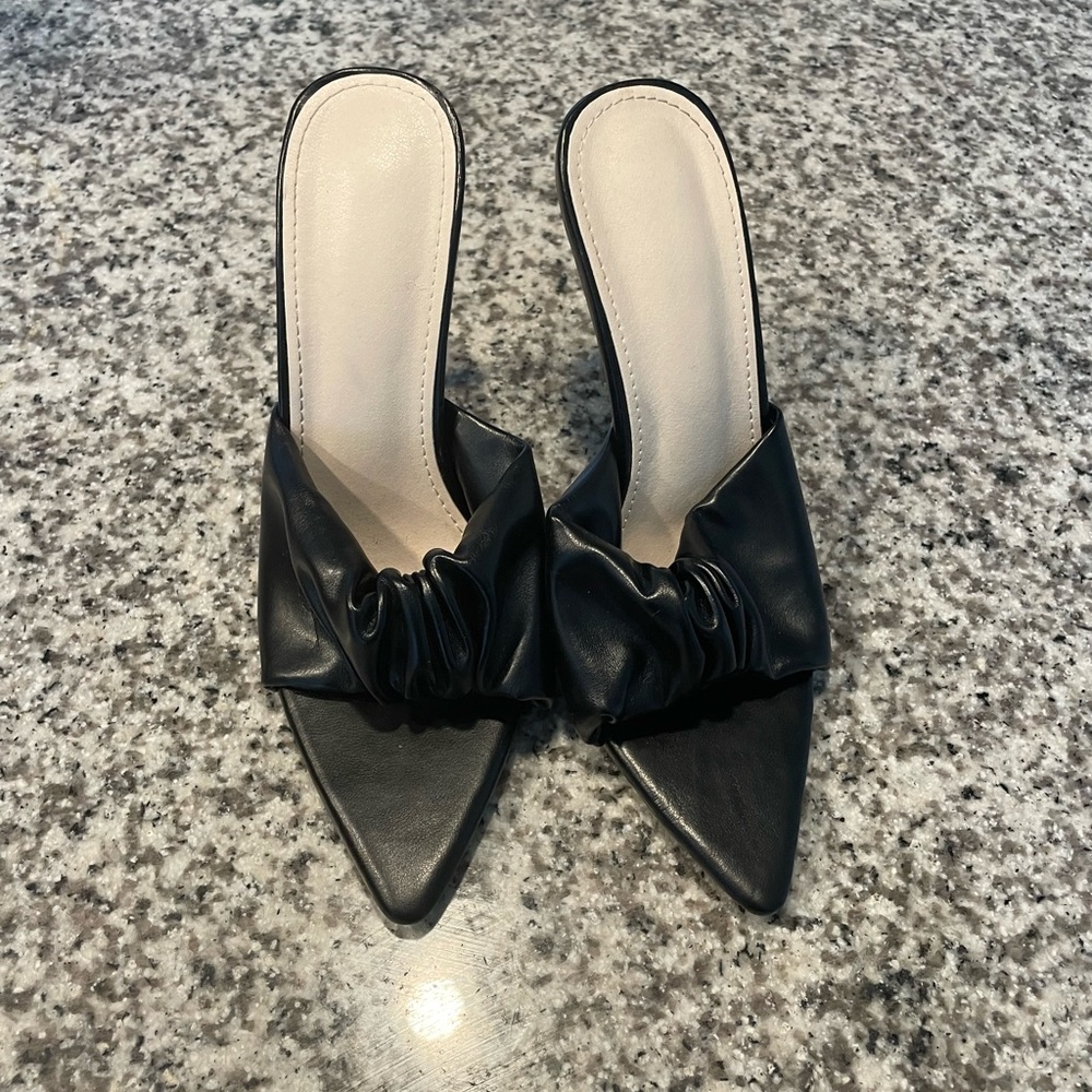 Pointed heel mules in Black size 8